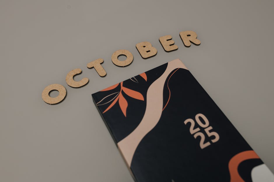 Stylized 2025 calendar with October written in wooden letters, perfect for planning and organization.